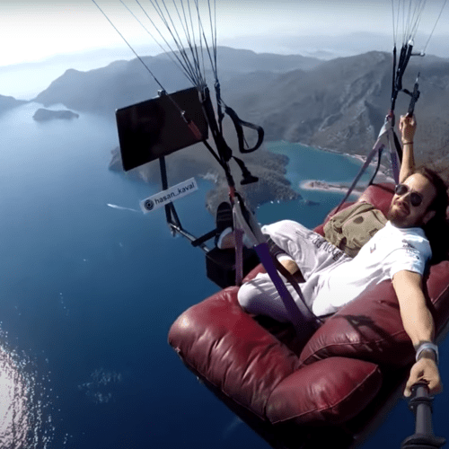 Man Flies His Entire Lounge Room Over The Ocean Because... Why Not?