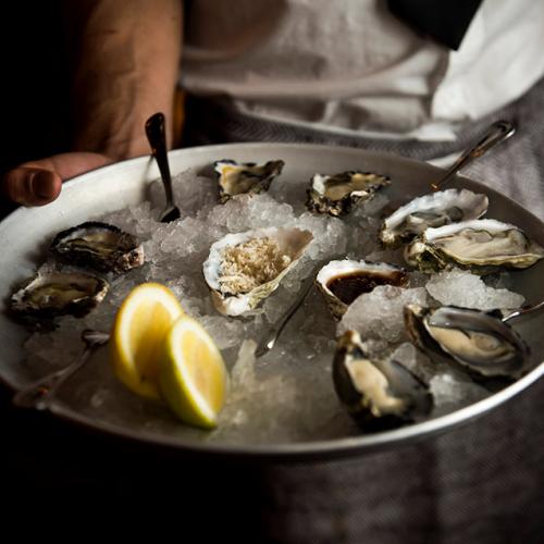 This Beach Club Is Offering $1 Oysters On Wednesdays For The Rest Of July