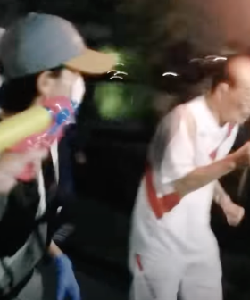 A Japanese Woman Tried To Sabotage The Olympic Torch With A Water Pistol